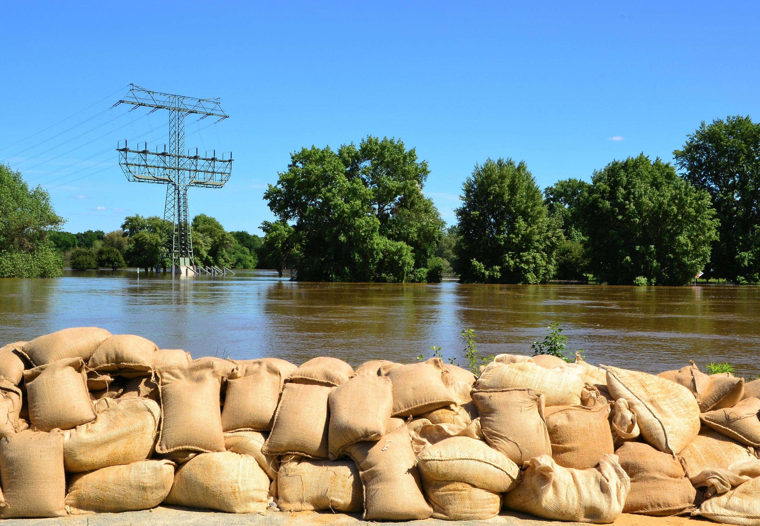 Sandbags on the banks of the river Elbe to protect against the flood at high tide in Magdeburg